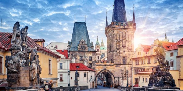 Sunrise on Charles bridge in Prague Czech Republic picturesque landscape morning old Europe with vintage architecture and historical landmark.
